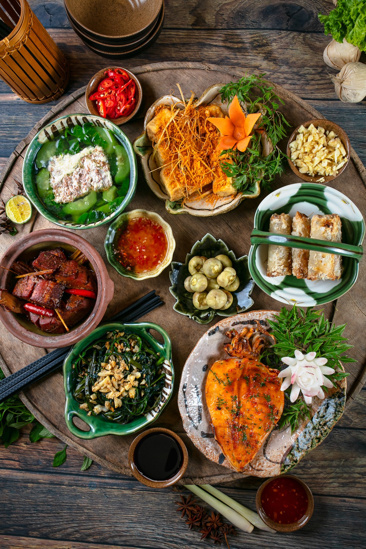 Family set menu dishes on a wooden table